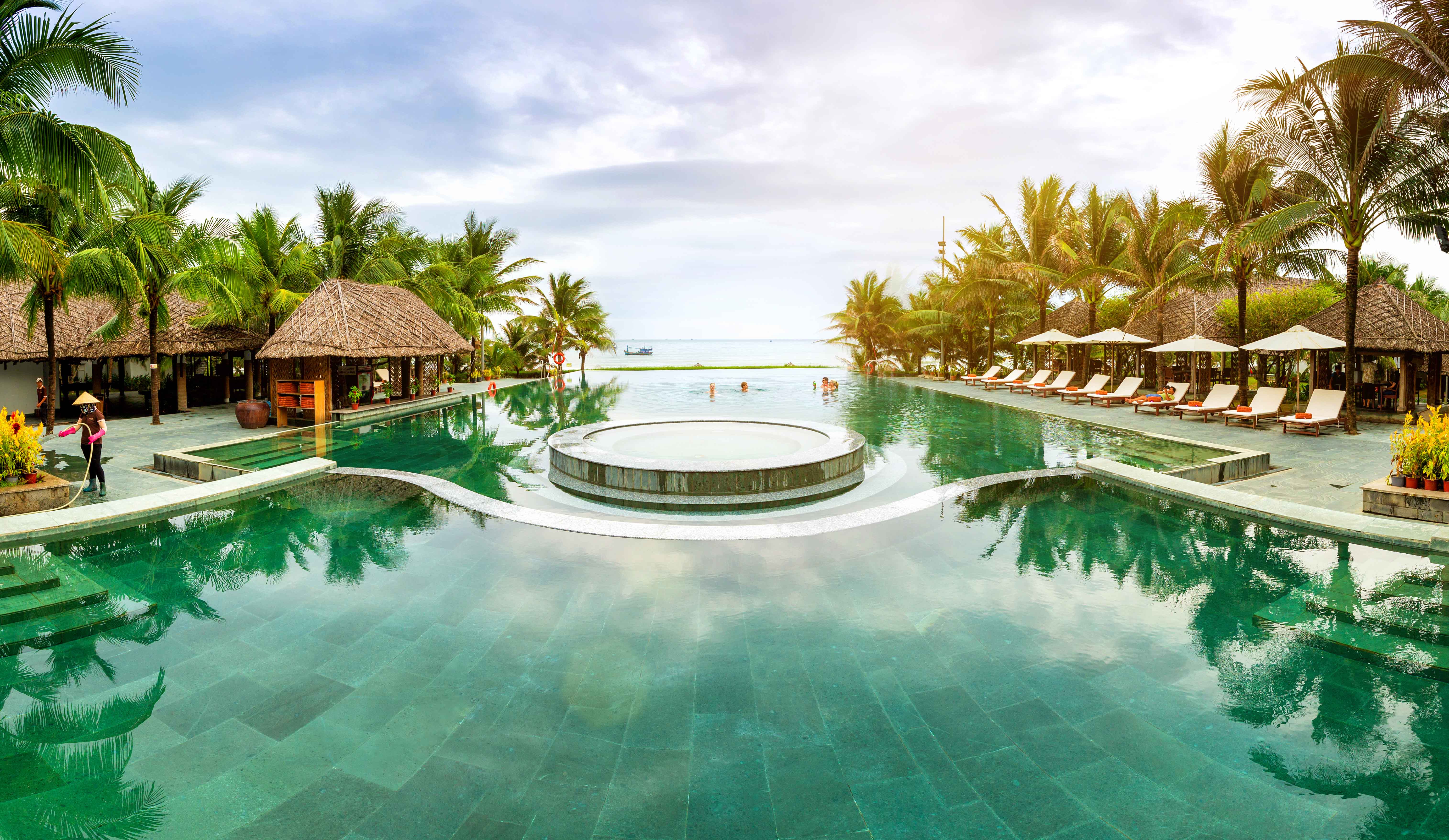 Sonata Resort & Spa infinity pool overlooking ocean with tropical pavilions